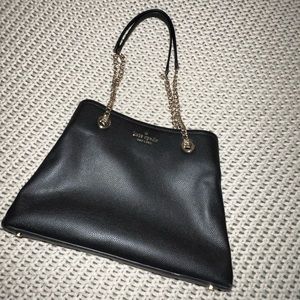 Black Kate Spade shoulder bag.